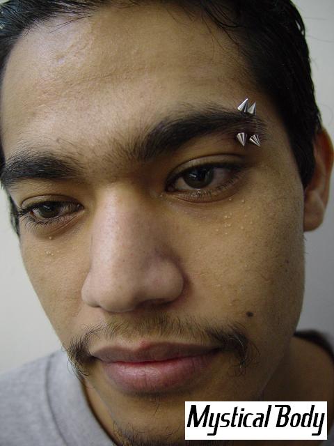 Eyebrow Piercings with cone-spiked. Curved Barbells